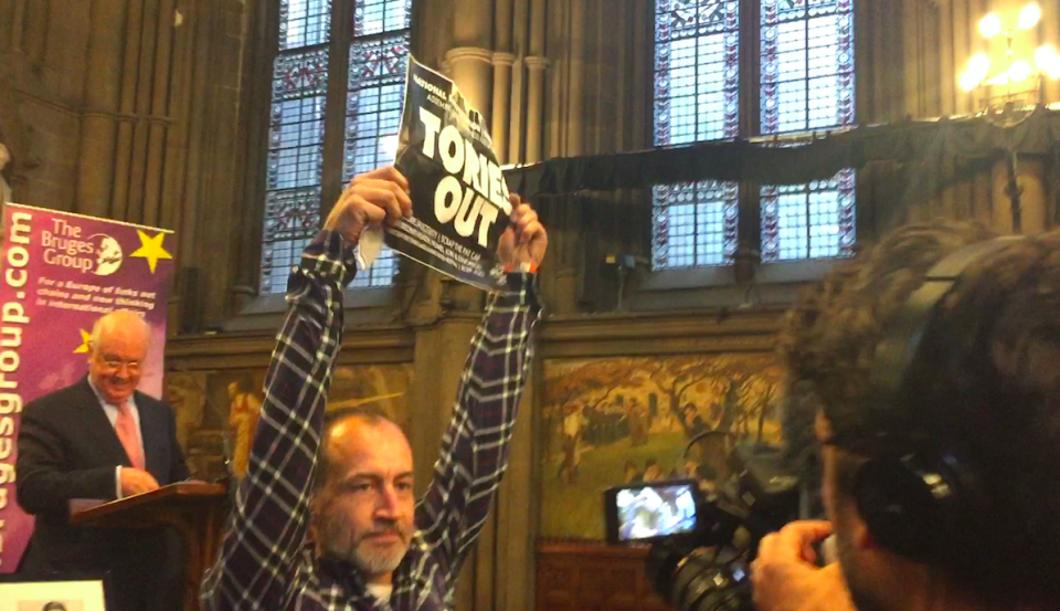 <em>Protestors held up ‘Tories Out’ signs at the meeting about Brexit (PA)</em>