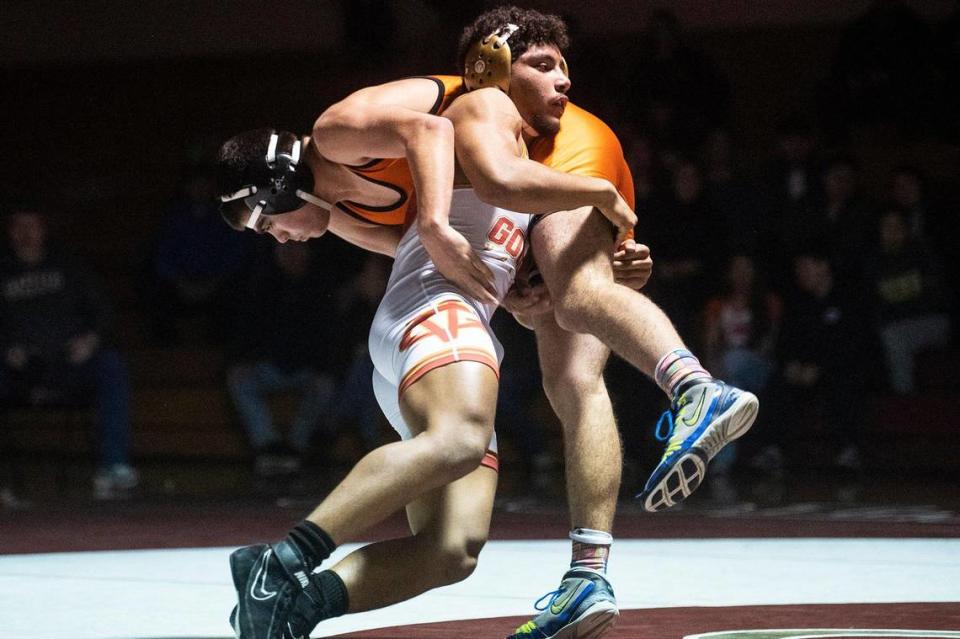 Golden Valley’s Isaac Le Blanc wrestles Merced’s Isiah Vera during a match at Golden Valley High School in Merced, Calif., on Tuesday, Jan. 23, 2024.