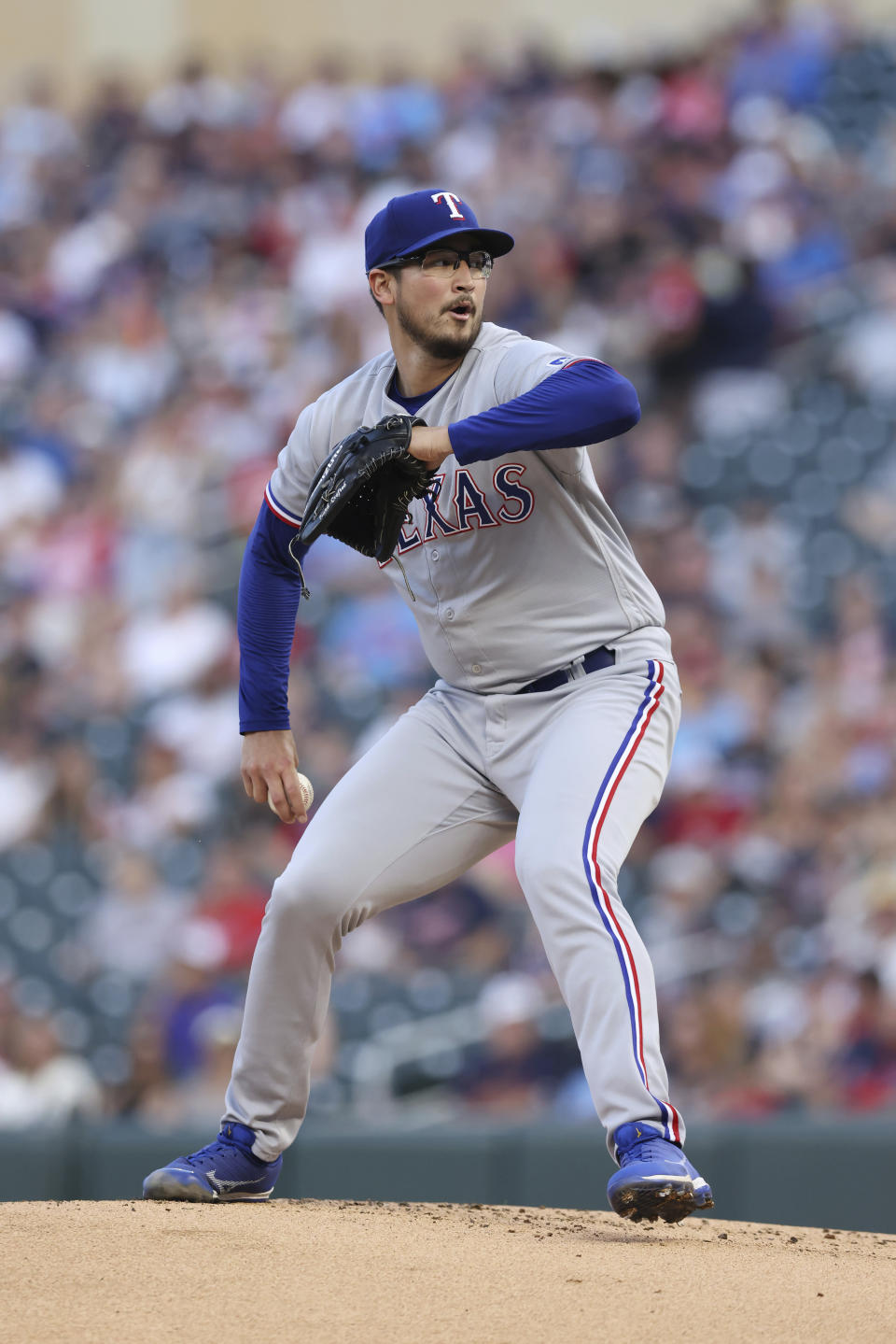 Texas Rangers starting pitcher Dane Dunning throws during the first inning of the team's baseball game against the Minnesota Twins, Friday, Aug. 25, 2023, in Minneapolis. (AP Photo/Stacy Bengs)