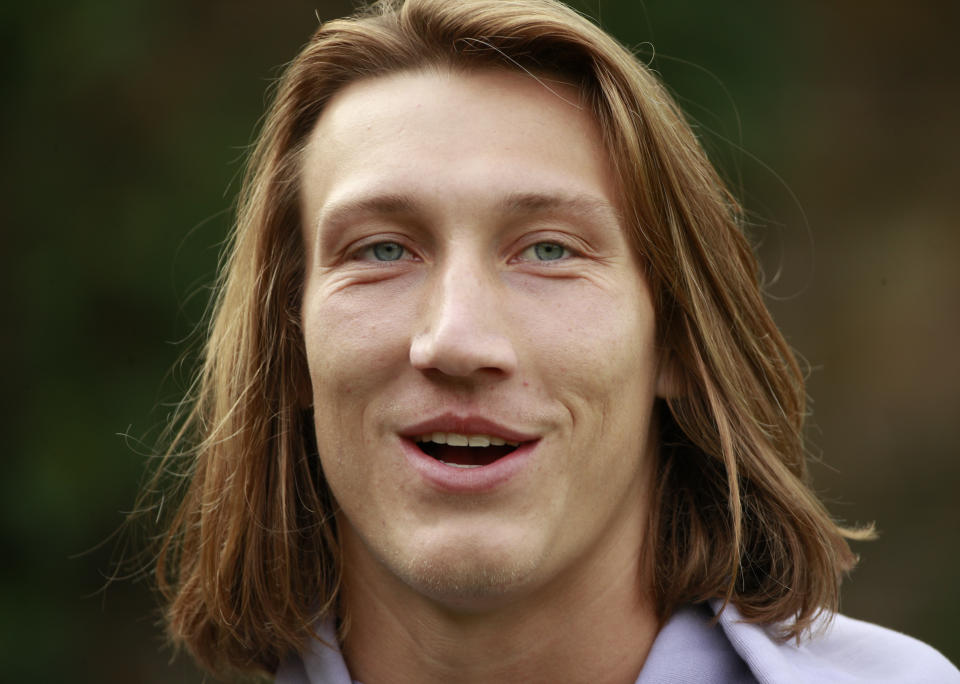 Jacksonville Jaguars quarterback Trevor Lawrence (16) answers a question during a practice and media availability by the Jacksonville Jaguars at Chandlers Cross, England, Friday, Oct. 15, 2021. The Jaguars will plat the Miami Dolphins in London on Sunday. (AP Photo/Ian Walton)