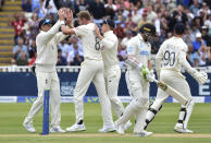 England's Stuart Broad, second left, celebrates with teammates the dismissal of New Zealand's captain Tom Latham, second right, during the second day of the second cricket test match between England and New Zealand at Edgbaston in Birmingham, England, Friday, June 11, 2021. (AP Photo/Rui Vieira)