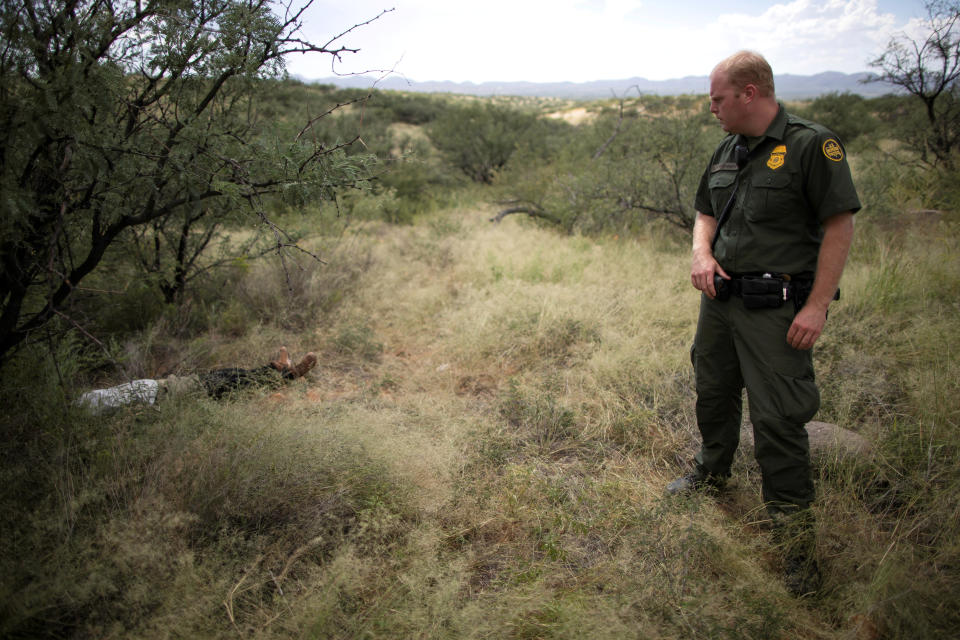 Border Patrol Agent Jacob Stukenberg with Guatemalan migrant Misael Paiz