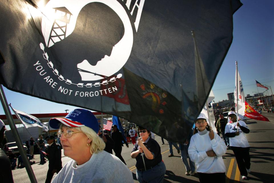 Kathie Kennedy, left, joined other from Operation Stand Down in the Veterans Day Parade along Broadway in downtown Nashville Nov 11, 2005.