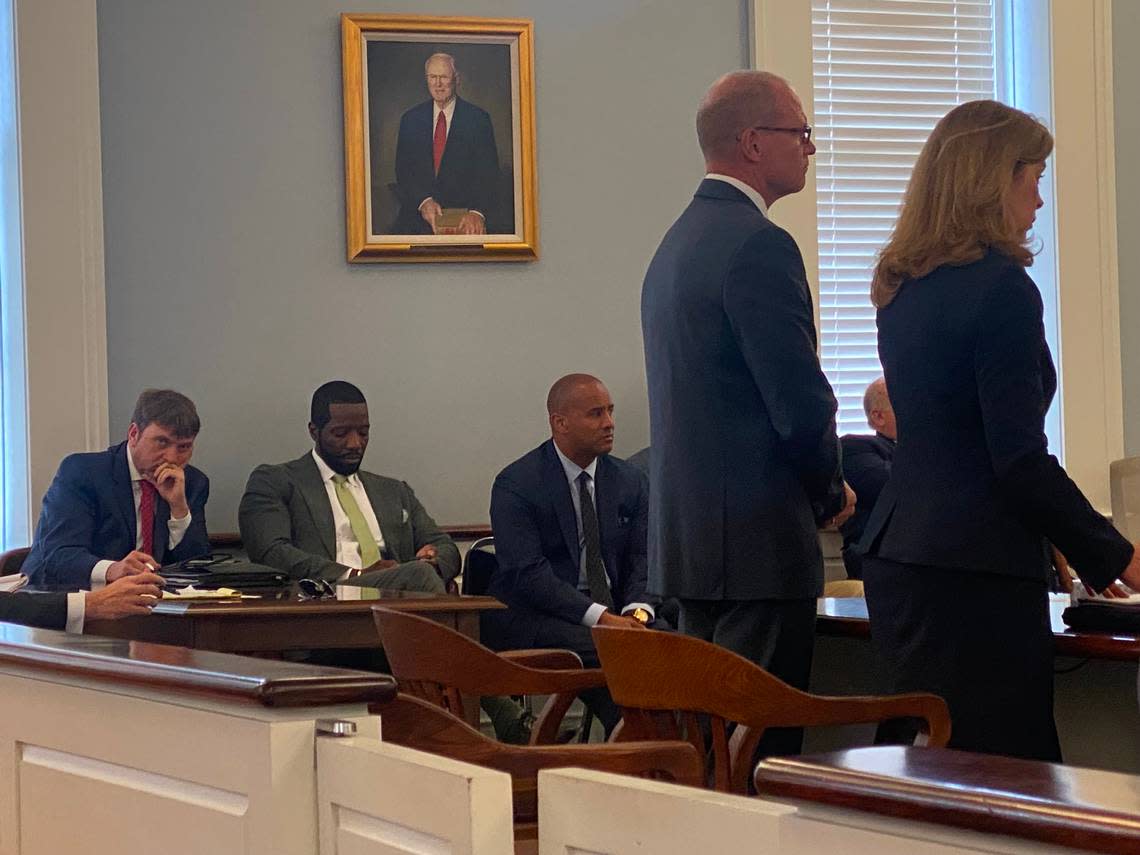 Suspended Beaufort lawyer Cory Fleming, right, stands with his attorney Debbie Barbier, far right, before Judge Clifton Newman on Friday, April 21, 2023, in Hampton, S.C.