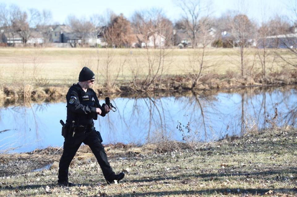 Greenwood police Cpl. Thomas Calhoun worked at the scene of a rescue, where he and the police chief helped save an infant. The child’s father allegedly tried to drown the infant in the pond and then turned himself in to police. Tammy Ljungblad - The Kansas City Star