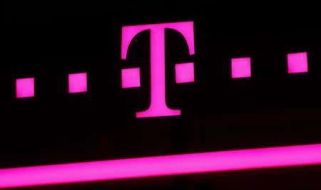 The logo of Deutsche Telekom is seen at a store in Bonn, April 3, 2013. REUTERS/Wolfgang Rattay