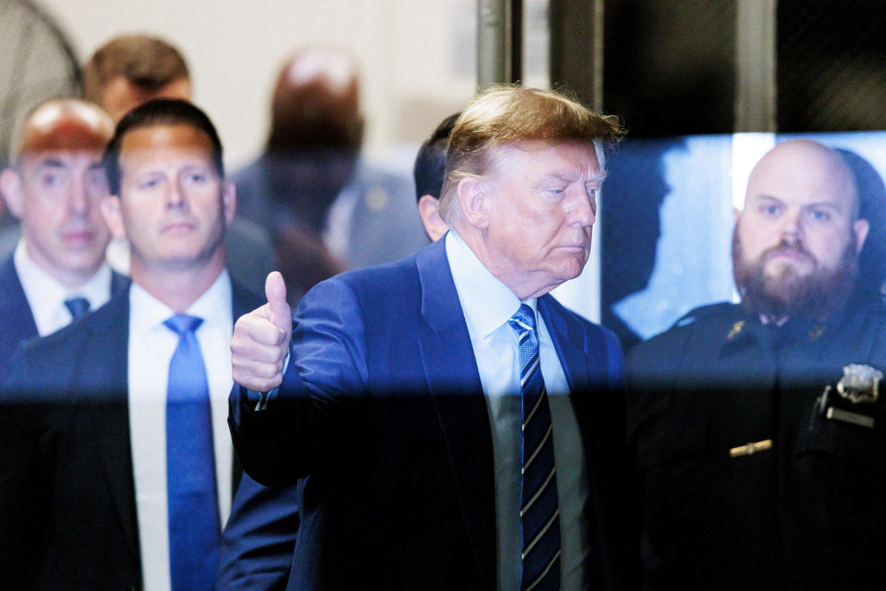 Donald Trump gives the thumbs-up as he returns to the courtroom (Justin Lane / AFP - Getty Images Pool)