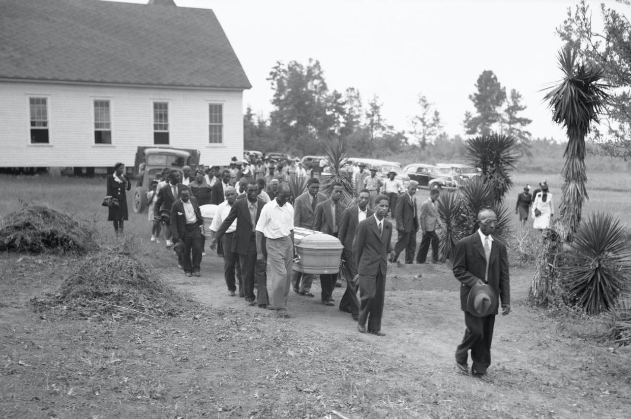 <span class="caption">A funeral held in July 1945 for two victims of the Ku Klux Klan, George Dorsey and his sister, Dorothy Dorsey Malcolm, of Walton County, Georgia, held at the Mt. Perry Baptist Church Sunday. </span> <span class="attribution"><a class="link " href="https://www.gettyimages.com/detail/news-photo/the-funeral-for-two-of-the-victims-in-the-july-25th-news-photo/514970326?adppopup=true" rel="nofollow noopener" target="_blank" data-ylk="slk:Bettman via Getty;elm:context_link;itc:0;sec:content-canvas">Bettman via Getty</a></span>