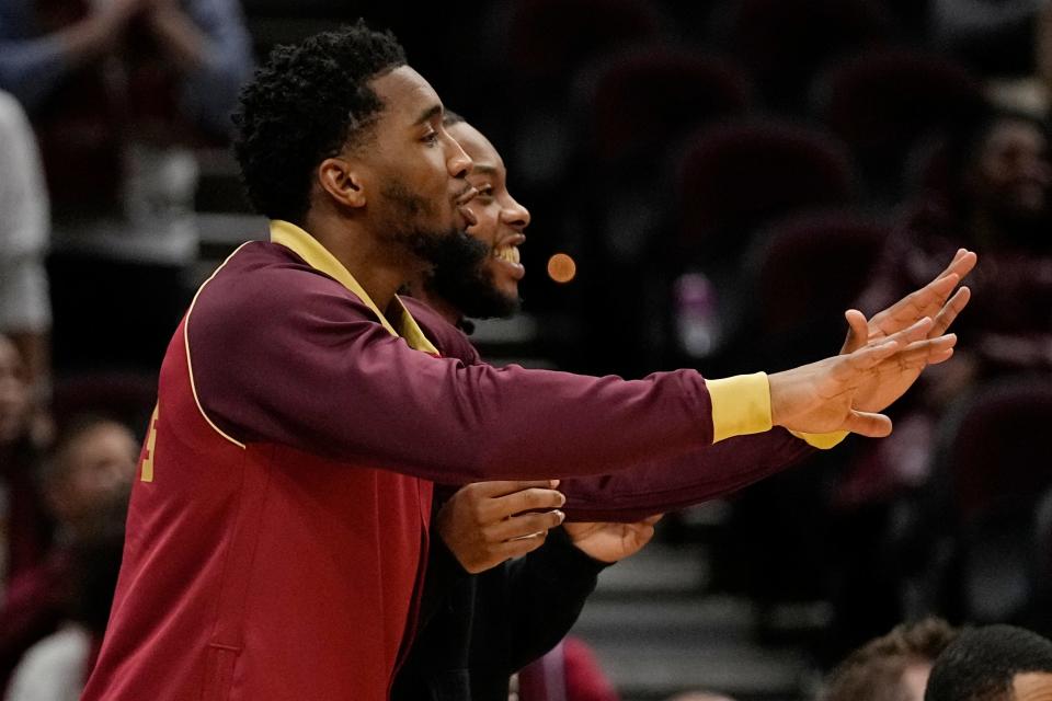 Cleveland Cavaliers guard Donovan Mitchell gestures from the bench in the second half against the Washington Wizards on Jan. 3 in Cleveland.