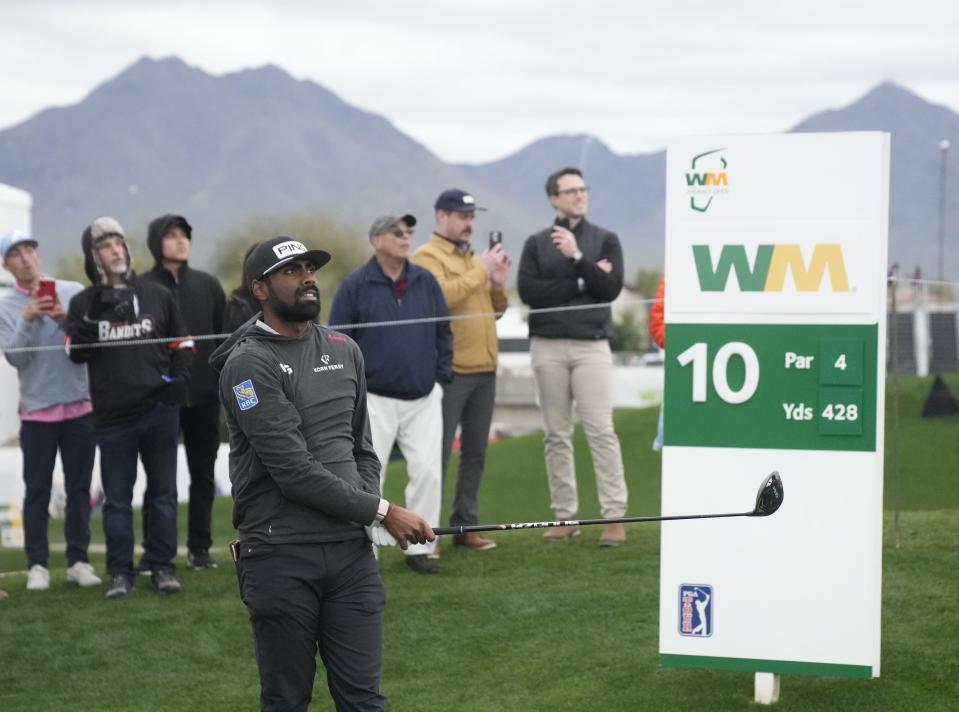 Sahith Theegala watches his ball from the 10th tee box during round 1 of the WM Phoenix Open at TPC Scottsdale on Feb. 8, 2024.