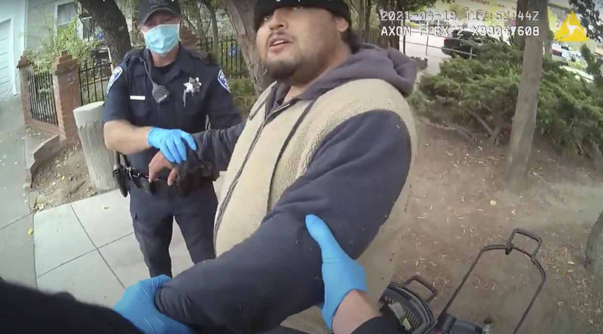 In this image taken from Alameda Police Department body camera video, Alameda Police Department officers attempt to take 26-year-old Mario Gonzalez into custody, April 19, 2021, in Alameda, Calif. The video goes on to show officers pinning Gonzalez to the ground during the arrest that ended in his death. (Alameda Police Department via AP)