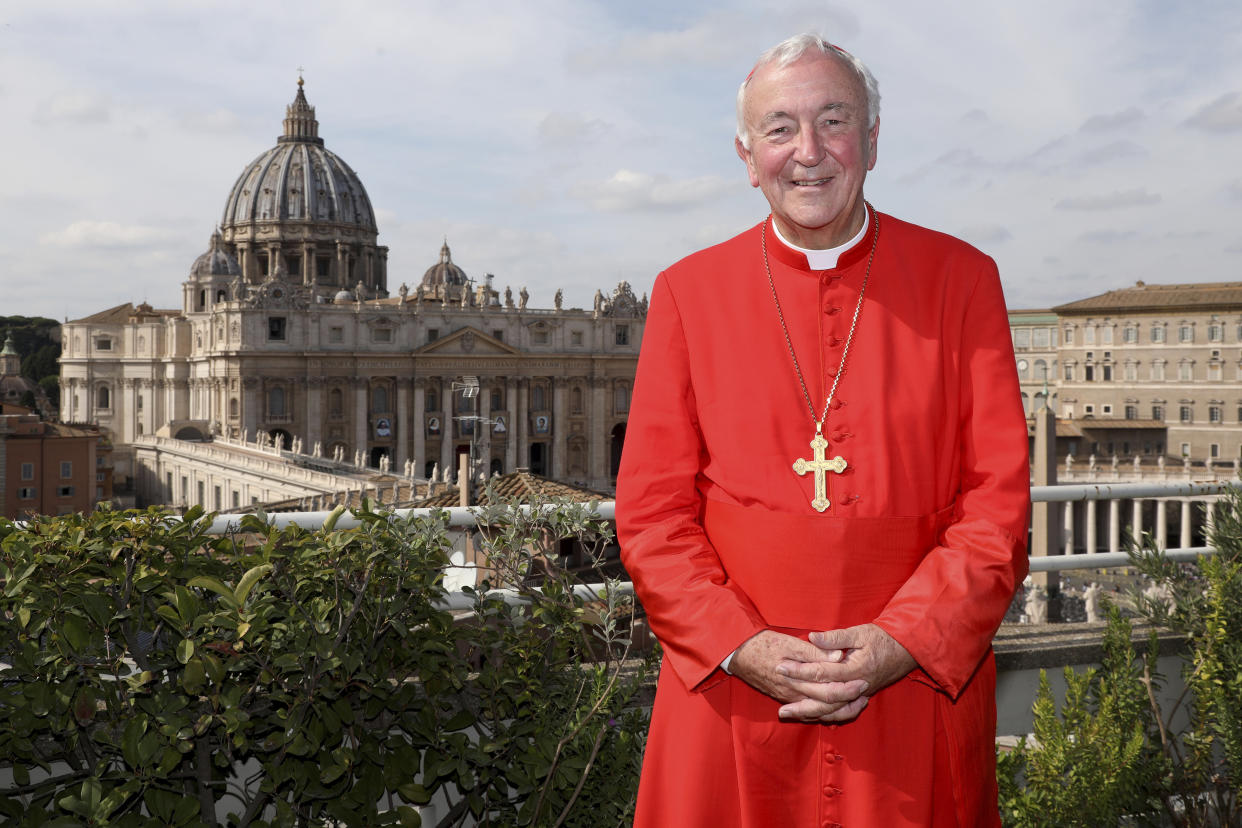 Archbishop of Westminster and President of the Catholic Bishops' Conference of England and Wales Vincent Gerard Nichols poses in front the St. Peter's Basilica during a reception for the Cardinal Newman Canonization at Pontifical Urban College, Sunday, Oct. 13, 2019 in Vatican City, Vatican. Pope Francis on Sunday canonized Cardinal John Henry Newman, the 19th-century Anglican convert who became an immensely influential, unifying figure in both the Anglican and Catholic churches.(Franco Origlia/pool photo via AP)
