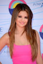 <p>Gomez was pretty in bright pink with long <a rel="nofollow noopener" href="http://people.com/style/bad-hombres-best-ombre-hair-colors/" target="_blank" data-ylk="slk:ombre locks;elm:context_link;itc:0;sec:content-canvas" class="link ">ombre locks</a> and sparkly lipgloss at the 2012 Teen Choice Awards.</p>