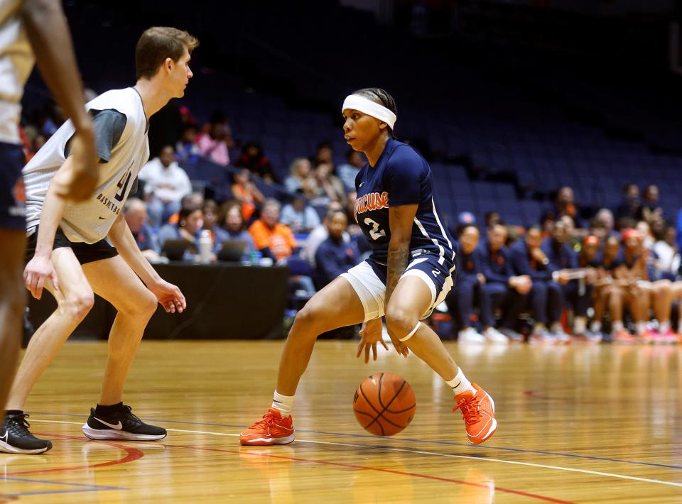 Rochester’s Dyaisha Fair plays in a scrimmage against a men’s practice squad at the Blue Cross Arena.