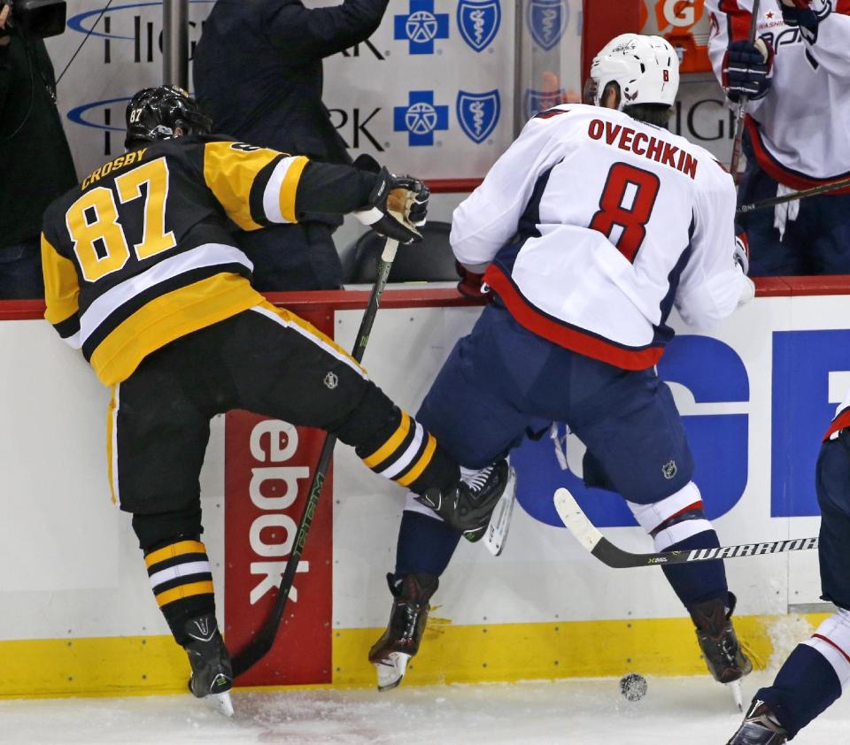 Pittsburgh Penguins' Sidney Crosby (87) collides with Washington Capitals' Alex Ovechkin (8) in the first period of an NHL hockey game in Pittsburgh, Monday, Jan. 16, 2017. (AP Photo/Gene J. Puskar)