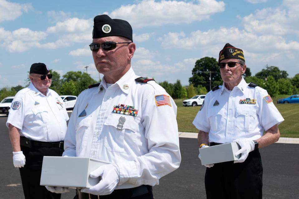 Veterans carry the unclaimed veterans' ashes into the columbarium at Washington Crossing National Cemetery in Upper Makefield on Thursday, June 30, 2022. Bucks County Coroner's Office and Montgomery County Coroner's Office honored their unclaimed veterans at a combined service with the attendance of community members and veterans.