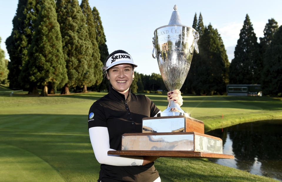 Hannah Green, of Australia, poses with the trophy after winning the LPGA Cambia Portland Classic golf tournament in Portland, Ore., Sunday, Sept. 1, 2019. (AP Photo/Steve Dykes)