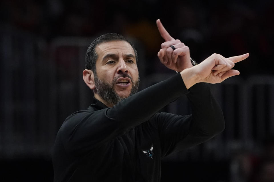 Charlotte Hornets head coach James Borrego gestures to players during the first half of the team's NBA play-in basketball game against the Atlanta Hawks on Wednesday, April 13, 2022, in Atlanta. (AP Photo/John Bazemore)
