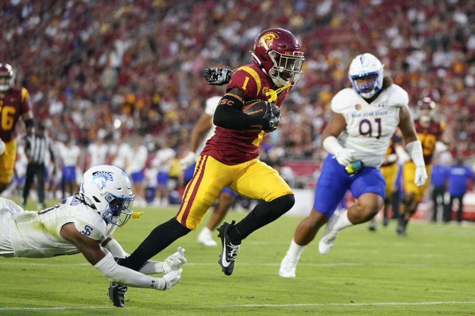 Southern California wide receiver Zachariah Branch (1) runs toward the end zone.