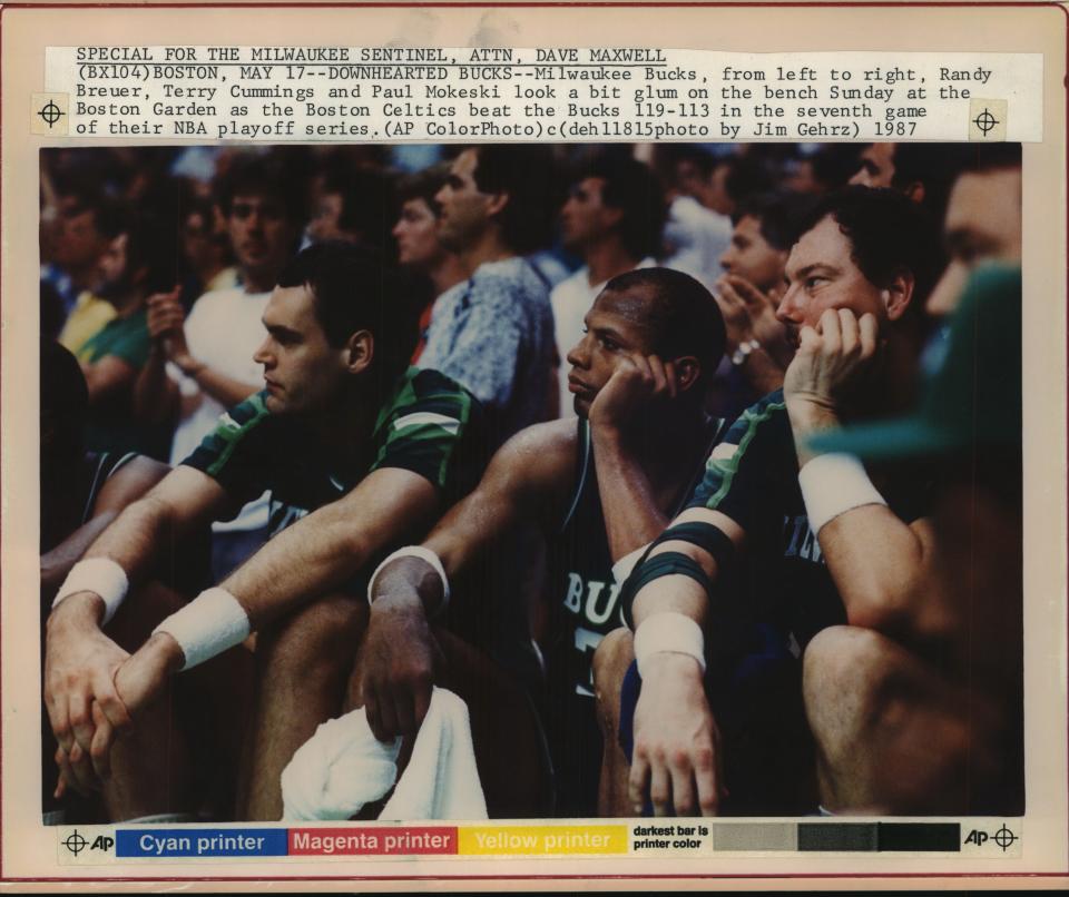 Milwaukee Bucks players (from left) Randy Breuer, Terry Cummings and Paul Mokeski look a bit glum on the bench Sunday at the Boston Garden as the Boston Celtics beat the Bucks, 119-113, in the seventh game of the 1987 Eastern Conference semifinals.