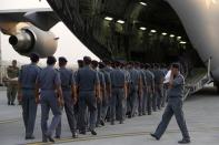 Members of India's National Disaster Response Force (NDRF) prepare to be flown to Nepal, at Hindon Air Force Station near New Delhi on April 25, 2015