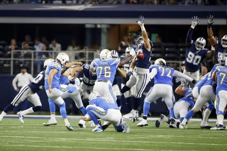 Nov 23, 2017; Arlington, TX, USA; Los Angeles Chargers punter Drew Kaser (8) misses a point after attempt in the fourth quarter against the Dallas Cowboys at AT&T Stadium. Mandatory Credit: Tim Heitman-USA TODAY Sports