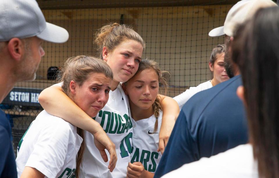 Colts Neck Julianna Kowaleski console each other as Coach Anthony Iachello tells them how proud he is for their historic season. Colts Neck softball falls to  Livingston 10-6 in Tournament of Champions play-in game at Seton Hall University on June 19, 2021. 