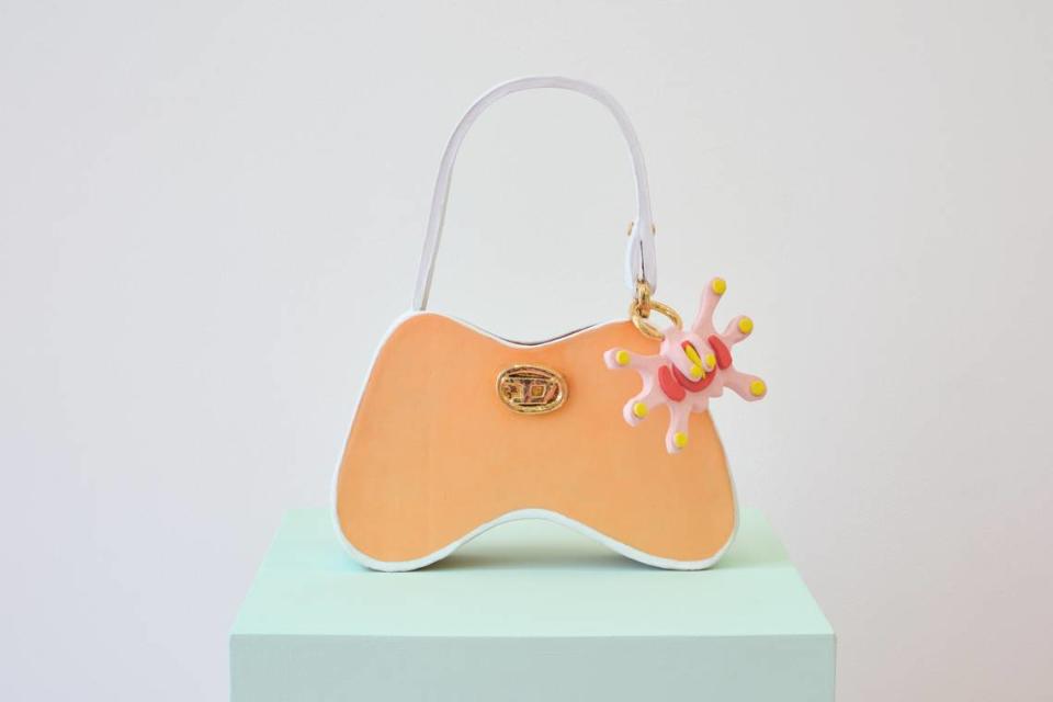 Artist Joel Gaitan made a ceramic recreation of his friend’s Diesel purse for his solo show “En El Corazón Del Infierno, En Las Alturas Del Cielo” at KDR. The piece is called “Sacred Object Study 2: Essential Everyday Bag.”