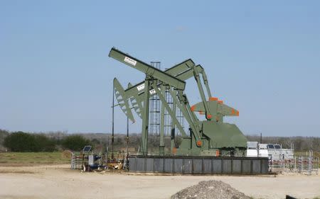 FILE PHOTO - A pump jack stands idle in Dewitt County, Texas January 13, 2016. REUTERS/Anna Driver/File Photo