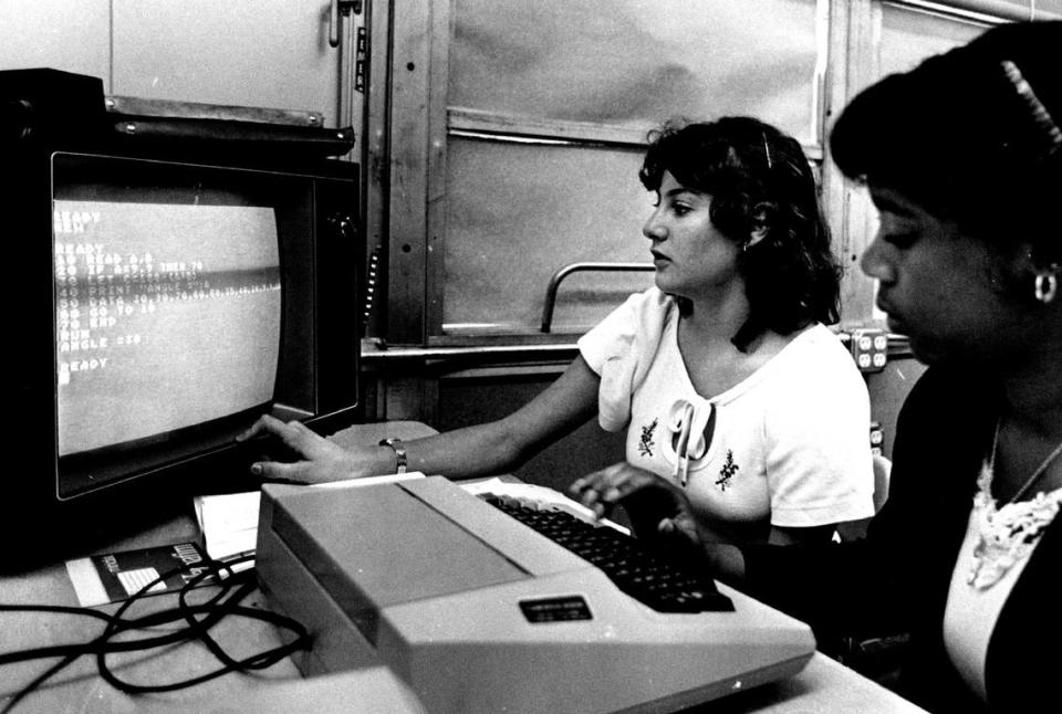 In 1982, Linda Samuels and Sherie Taylor in computer class at Palmetto high school. Miami Herald File