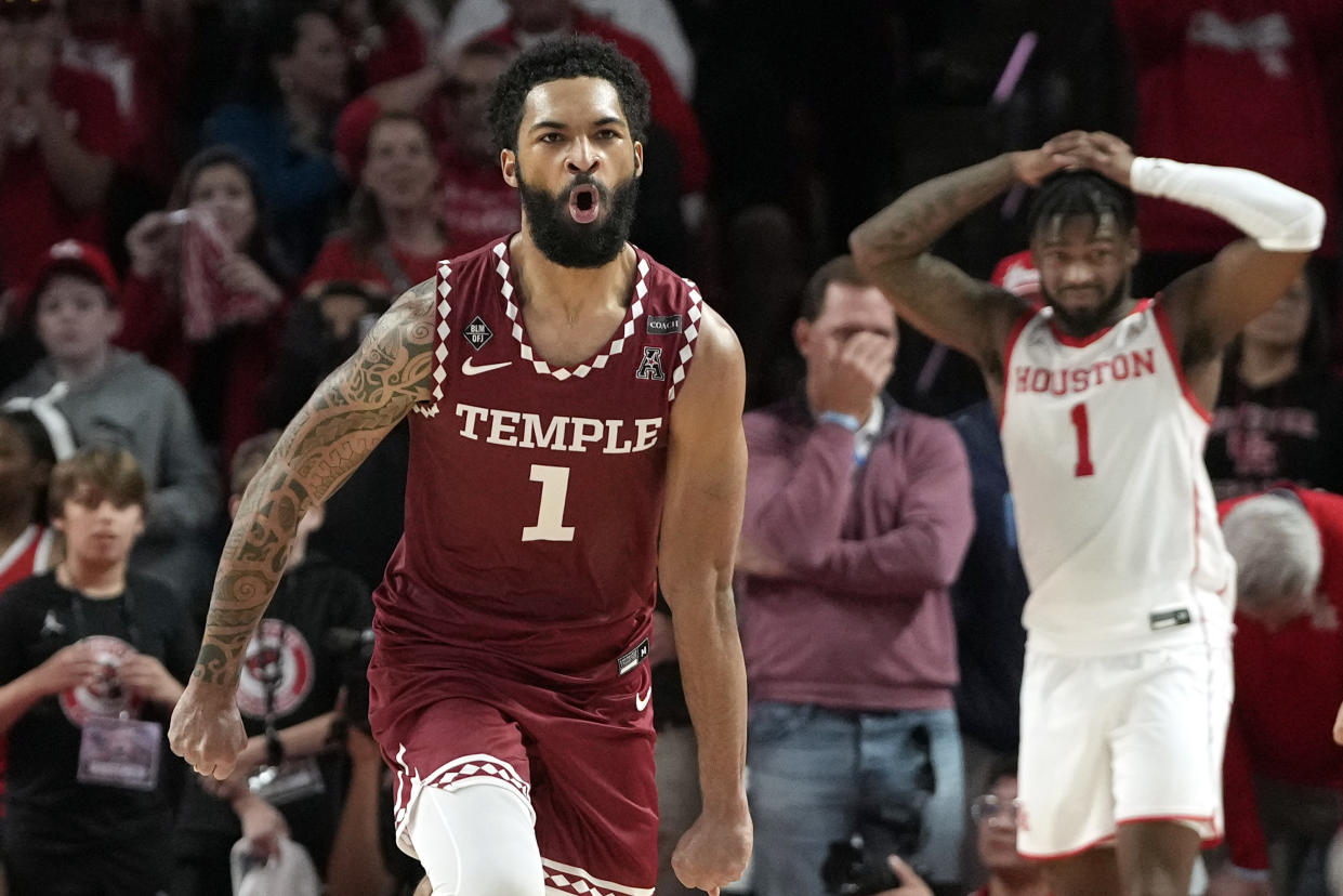 Temple's Damian Dunn, left, celebrates as Houston's Jamal Shead, right, reacts at the end of Temple's 56-55 win over No. 1 Houston on Sunday, Jan. 22, 2023, in Houston. (AP Photo/David J. Phillip)