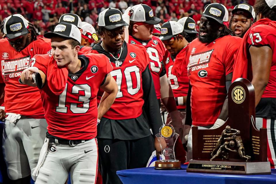 Georgia players react after defeating LSU in the SEC Championship game at Mercedes-Benz Stadium.