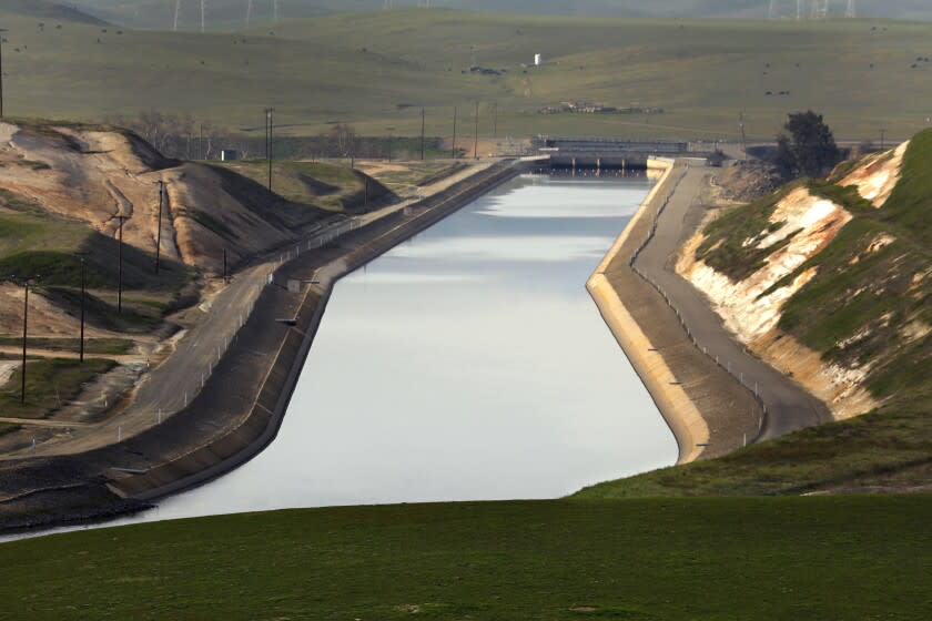 Santa Nella, CA, January 18, 2022 -The Delta-Mendota Canal runs south along the western edge of the San Joaquin Valley, parallel to the California Aqueduct for most of its journey, but it diverges to the east after passing San Luis Reservoir, which receives some of its water. The water is pumped from the canal and into O'Neill Forebay. Then it is pumped into San Luis Reservoir by the Gianelli Pumping-Generating Plant. (Carolyn Cole / Los Angeles Times)