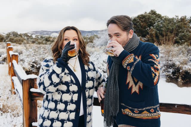 <p>Courtesy of Big Nose Kate</p> Melissa McCarthy and Ben Falcone (in New Mexico) invested in Big Nose Kate whiskey in 2022. "This whiskey is so smoky, we're going to smoke your mind," says Falcone.