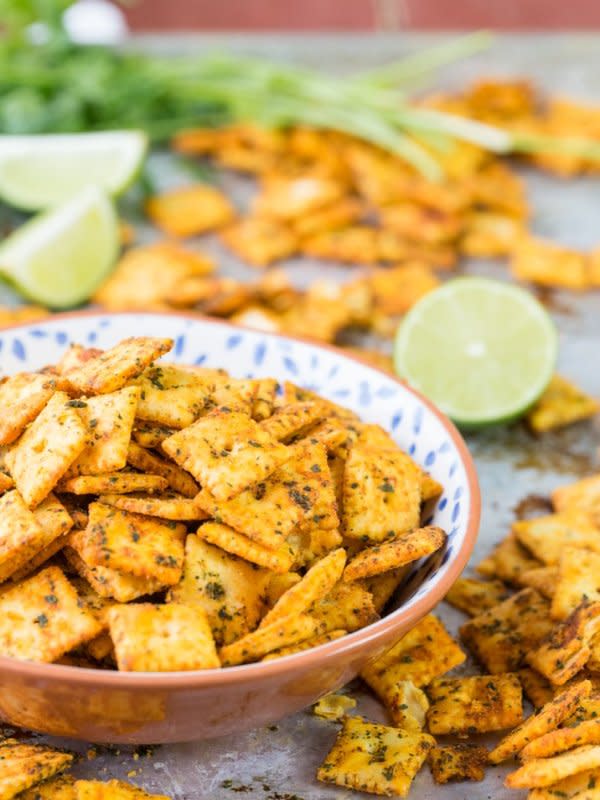 <p>The Cookie Rookie</p><p>These crackers are perfect for any party, game day or movie night. Made with cheese crackers, taco seasoning and cilantro. So addicting! </p><p><strong>Get the recipe: <a href="https://www.thecookierookie.com/mexican-spice-cheese-crackers/" rel="nofollow noopener" target="_blank" data-ylk="slk:Mexican Spice Cheese Crackers;elm:context_link;itc:0;sec:content-canvas" class="link rapid-noclick-resp">Mexican Spice Cheese Crackers</a></strong></p>