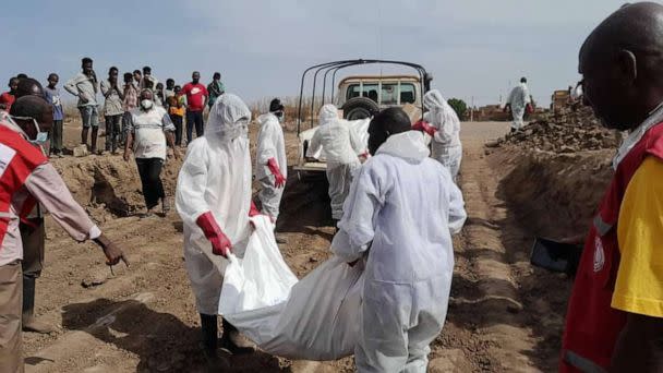 PHOTO: Members of the Sudanese Red Crescent Society work with volunteers to move bodies at Al-Shaqilab Cemetery in Khartoum, Sudan, in a photo taken on May 10, 2023, and released by the society. (Sudanese Red Crescent Society)