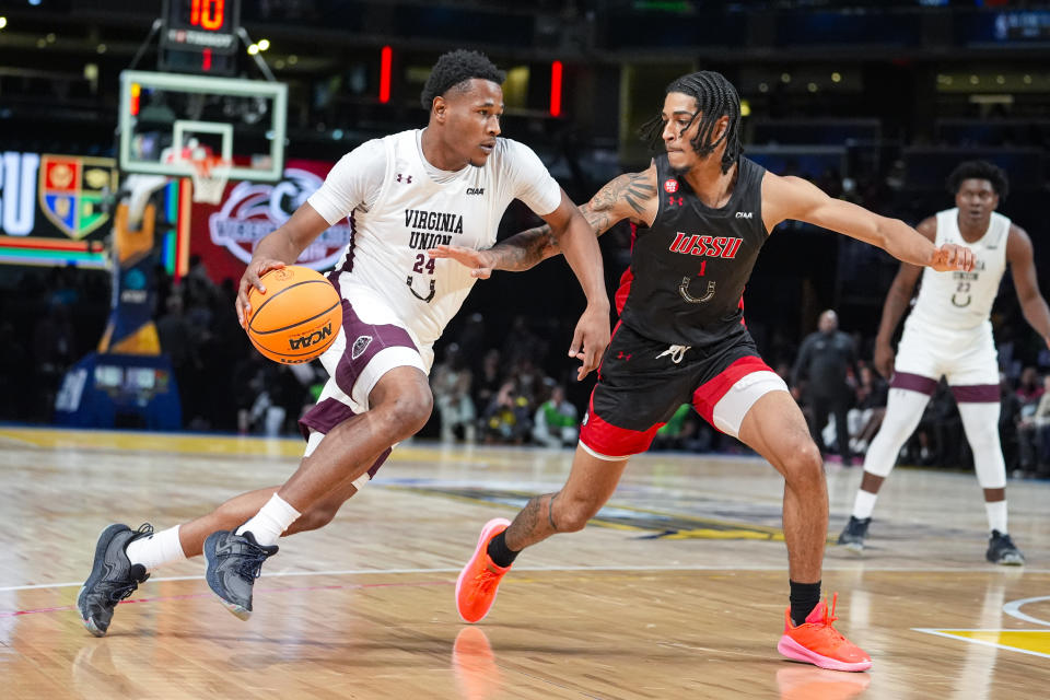 Virginia Union guard Tahj Harding (24) drives on Winston-Salem State guard Dalyn Brandon (1) during the first half of the HBCU Classic NCAA college basketball game in Indianapolis, Saturday, Feb. 17, 2024. (AP Photo/Michael Conroy