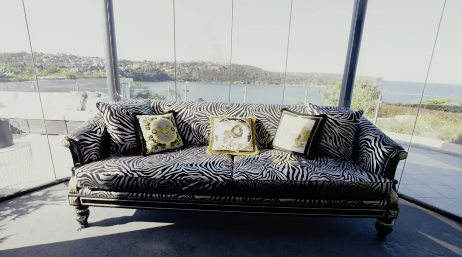 Animal print is a recurring trend throughout the house, with this zebra print couch being a key piece of furniture