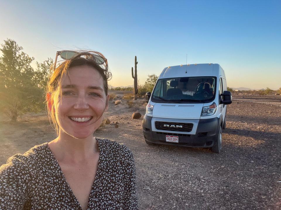 Business Insider's author in front of a campervan.