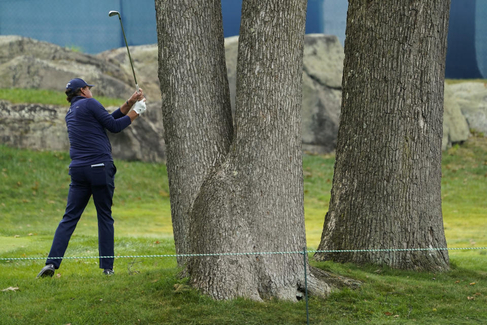 Phil Mickelson, of the United States, hits out of the rough on the 16th hole during the second round of the US Open Golf Championship, Friday, Sept. 18, 2020, in Mamaroneck, N.Y. (AP Photo/Charles Krupa)