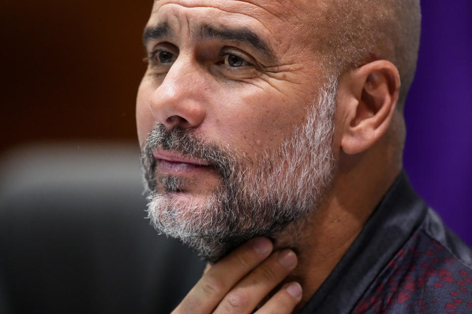 Manchester City's head coach Pep Guardiola attends a press conference at the King Abdullah Sports City Stadium in Jeddah, Saudi Arabia, Monday, Dec. 18, 2023. Urawa Reds will play against Manchester city during the semifinal soccer match during the Club World Cup on Tuesday Dec. 19. (AP Photo/Manu Fernandez)