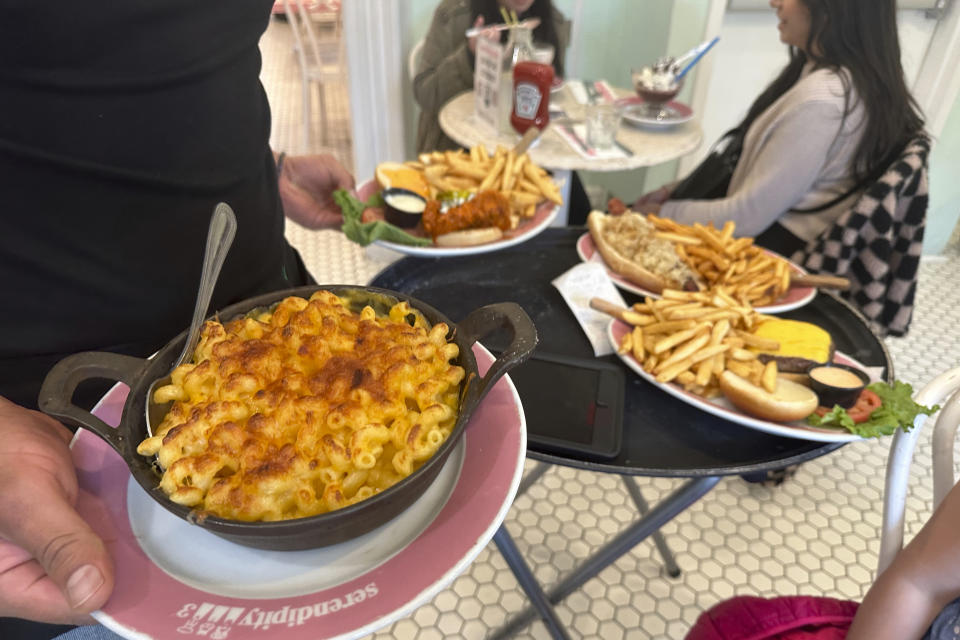 Food is served at Serendipity 3 restaurant in New York City on Sunday, October 8, 2023. On Thursday, the Commerce Department issues its first of three estimates of how the U.S. economy performed in the third quarter of 2023.(AP Photo/Ted Shaffrey)