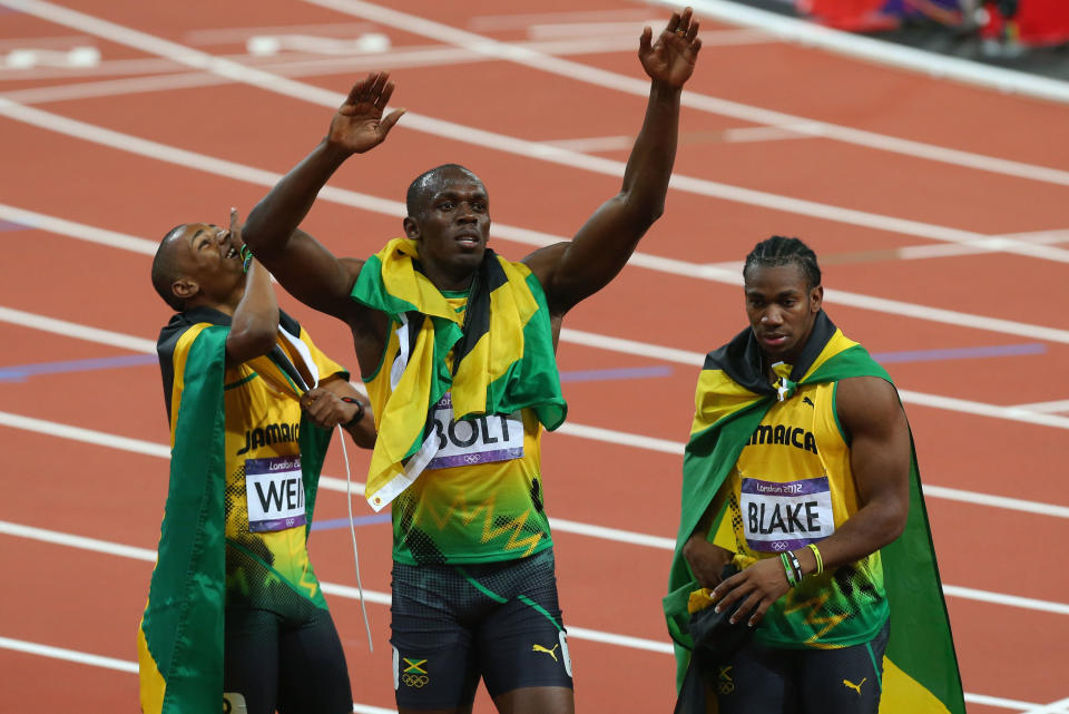 LONDON, ENGLAND - AUGUST 09: Gold medalist Usain Bolt (C) of Jamaica celebrates with silver medalist Yohan Blake (R) of Jamaica and bronze medalist Warren Weir (L) of Jamaica after the Men's 200m Final on Day 13 of the London 2012 Olympic Games at Olympic Stadium on August 9, 2012 in London, England. (Photo by Alex Livesey/Getty Images)