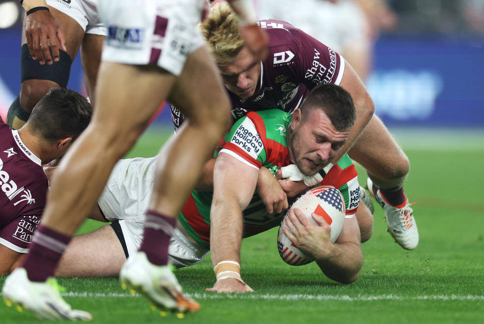 LAS VEGAS, NEVADA - MARCH 02: Jai Arrow of the Rabbitohs is tackled during the round one NRL match between Manly Sea Eagles and South Sydney Rabbitohs at Allegiant Stadium, on March 02, 2024, in Las Vegas, Nevada. (Photo by Ezra Shaw/Getty Images)