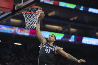 Sacramento Kings forward Trey Lyles scores against the Los Angeles Lakers during the first half of an NBA basketball game in Sacramento, Calif., Wednesday, Dec. 21, 2022. (AP Photo/José Luis Villegas)