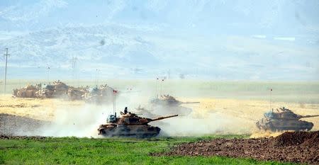 Turkish tanks are seen during a military exercise near the Turkish-Iraqi border in Silopi, Turkey, September 19, 2017. Dogan News Agency, DHA via REUTERS