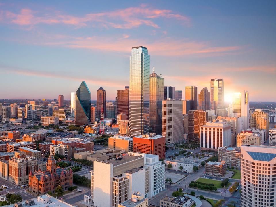 Dallas, Texas cityscape with blue sky at sunset, Texas