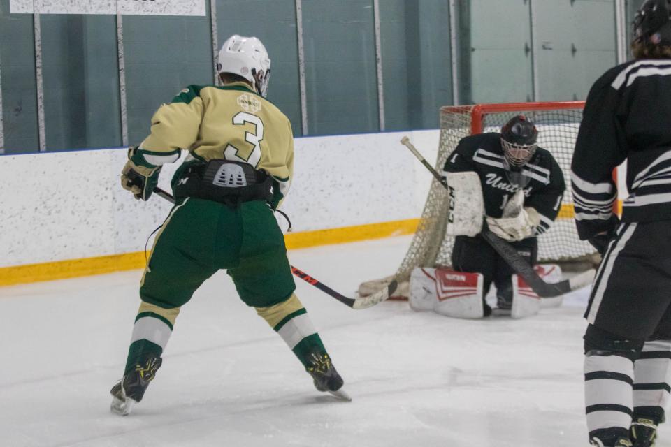 New Boston United goalie Logan Moran makes a save on a shot from SMCC's Jack Lisker Wednesday, Dec. 7, 2022. United won the game 7-5.