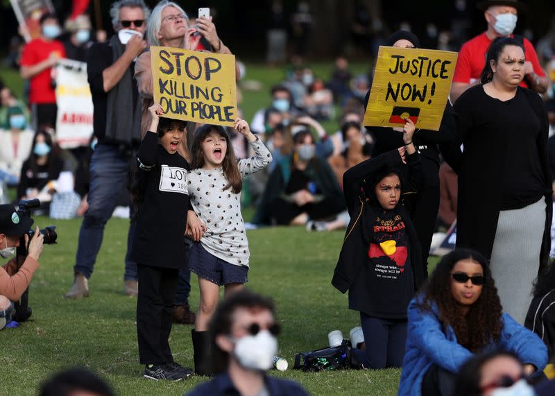 People demonstrate in solidarity with the Black Lives Matter (BLM) rallies in the United States, calling for an end to police brutality against Black people in the United States and First Nations people in Australia, in Sydney