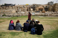 Tourists sit around the site of the old city of Caesarea, Israel April 26, 2017. REUTERS/Amir Cohen